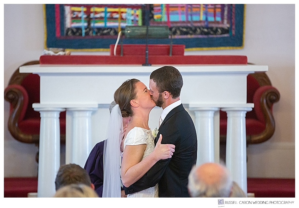 Bride and groom's first kiss at the Castine, Maine, UU Church