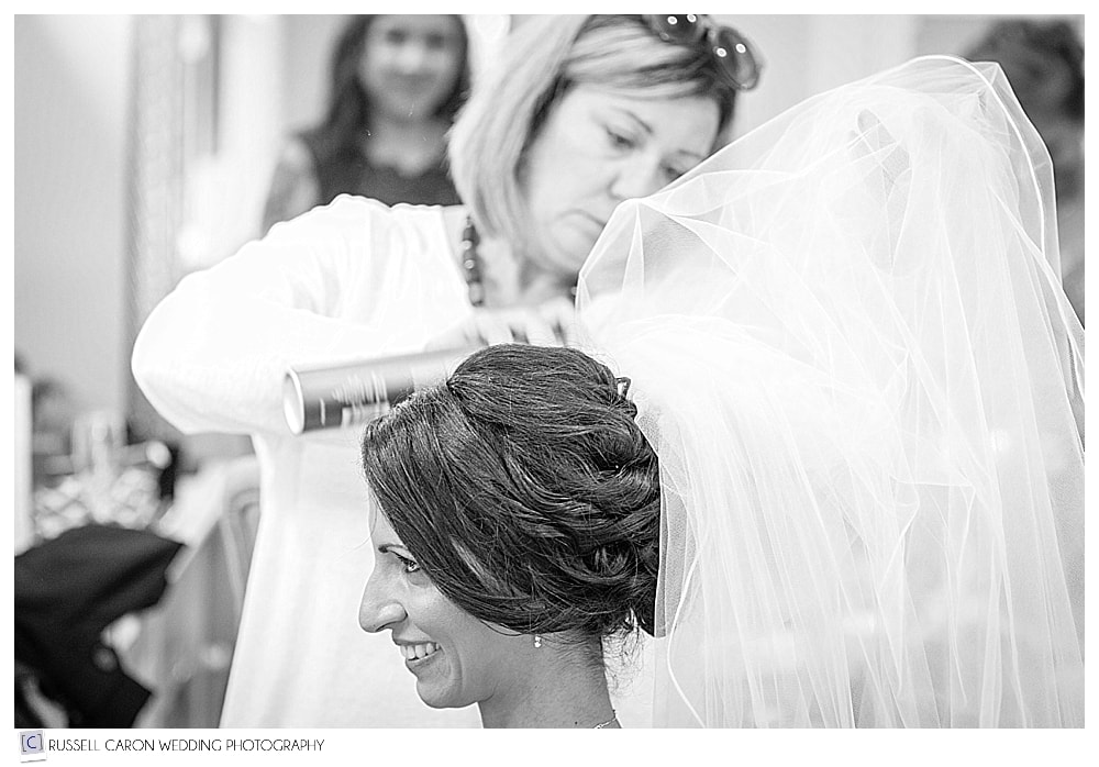bride's veil being put in hair