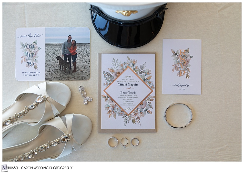 wedding day detail photo of rings, wedding invitation, bride's shoes, groom's military hat