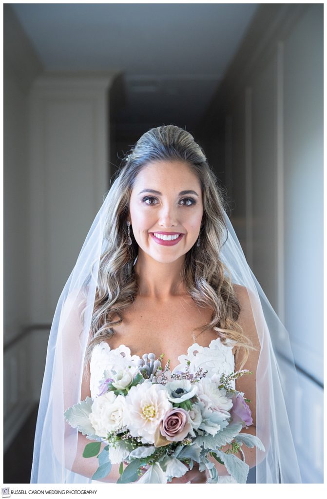 beautiful bridal portrait of a bride standing in a hallway