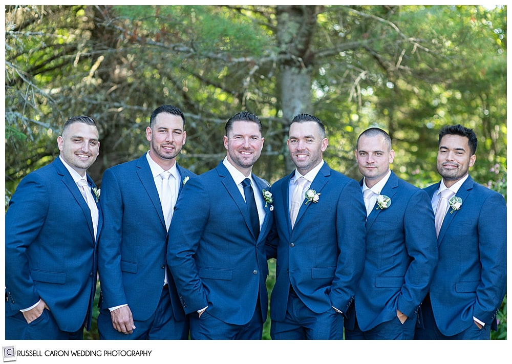groom with five groomsmen wearing blue suits