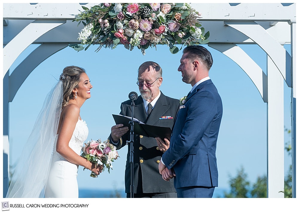 bride and groom at the outdoor ceremony site of Point Lookout, Northport, Maine