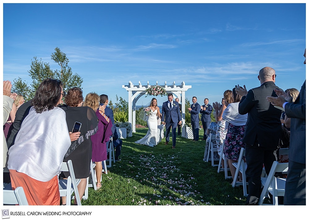 bride and groom recessional at their elegant point lookout wedding ceremony, Northport, Maine