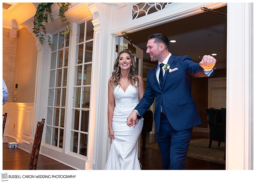 bride and groom being announced into their elegant point lookout wedding reception