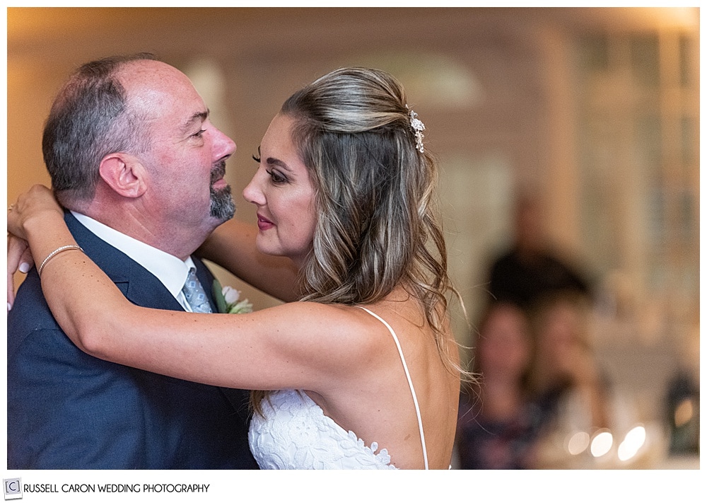 bride dancing with her father, they are facing each other