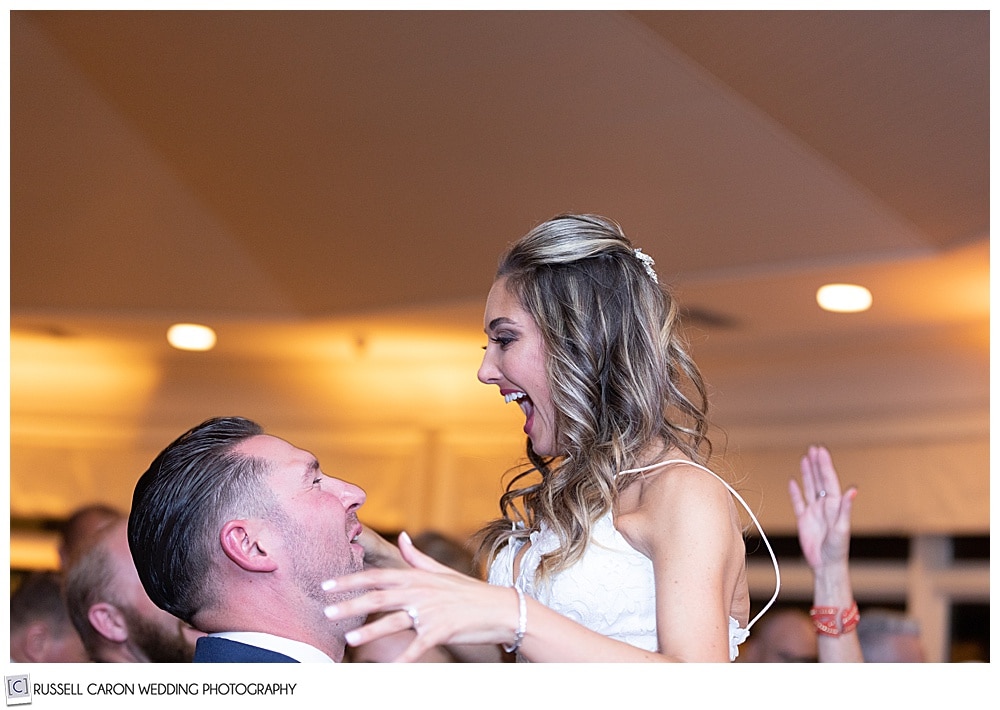 groom lifts bride as they're dancing, you see their heads