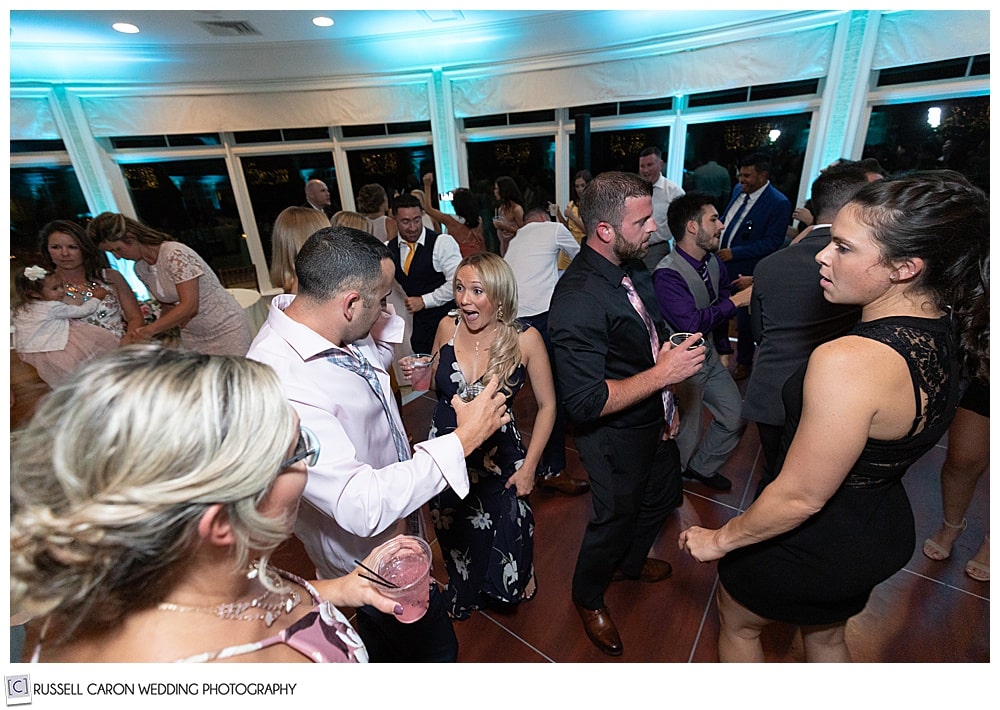 wedding guests dancing at an elegant point lookout wedding, northport, maine