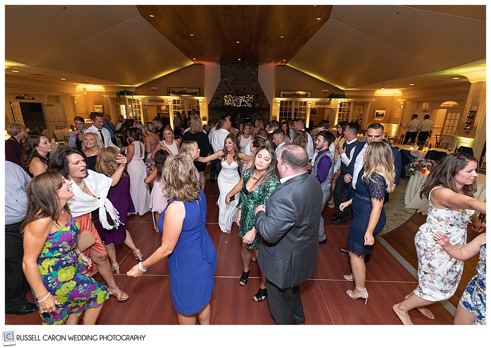 bride with two of her friends, in the middle of the dance floor at her elegant point lookout wedding reception