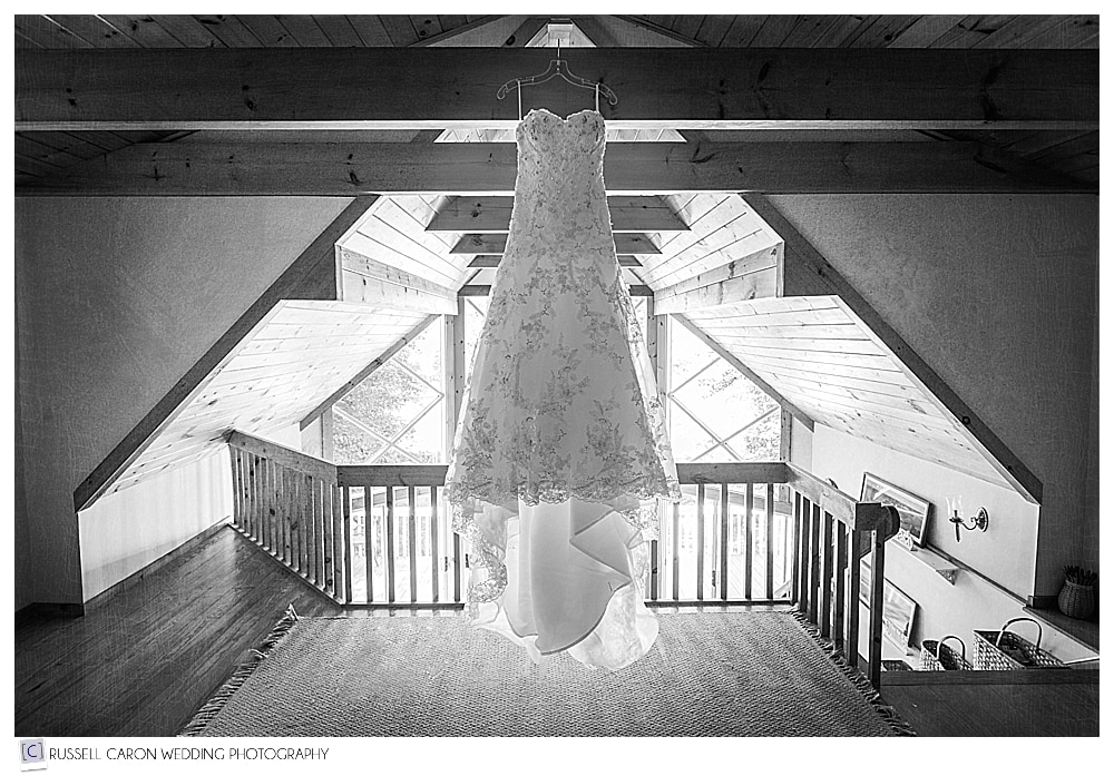 wedding dress hanging in the rafters