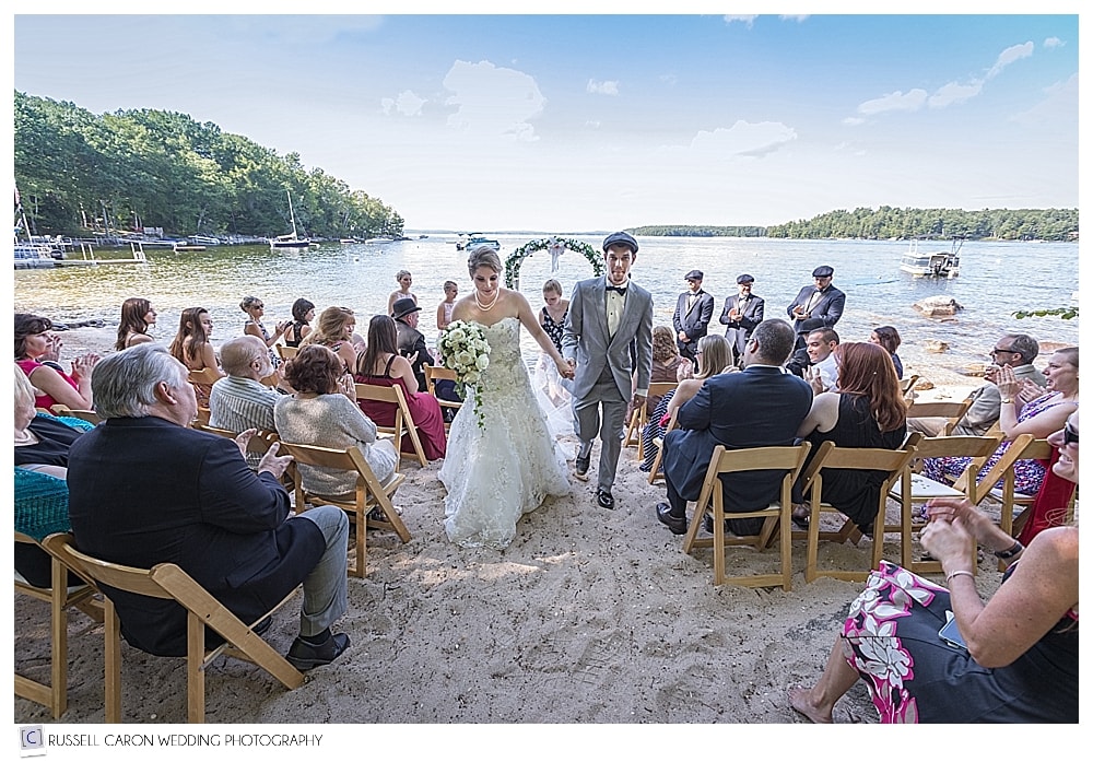 bride and groom during recessional at their Frye Island wedding