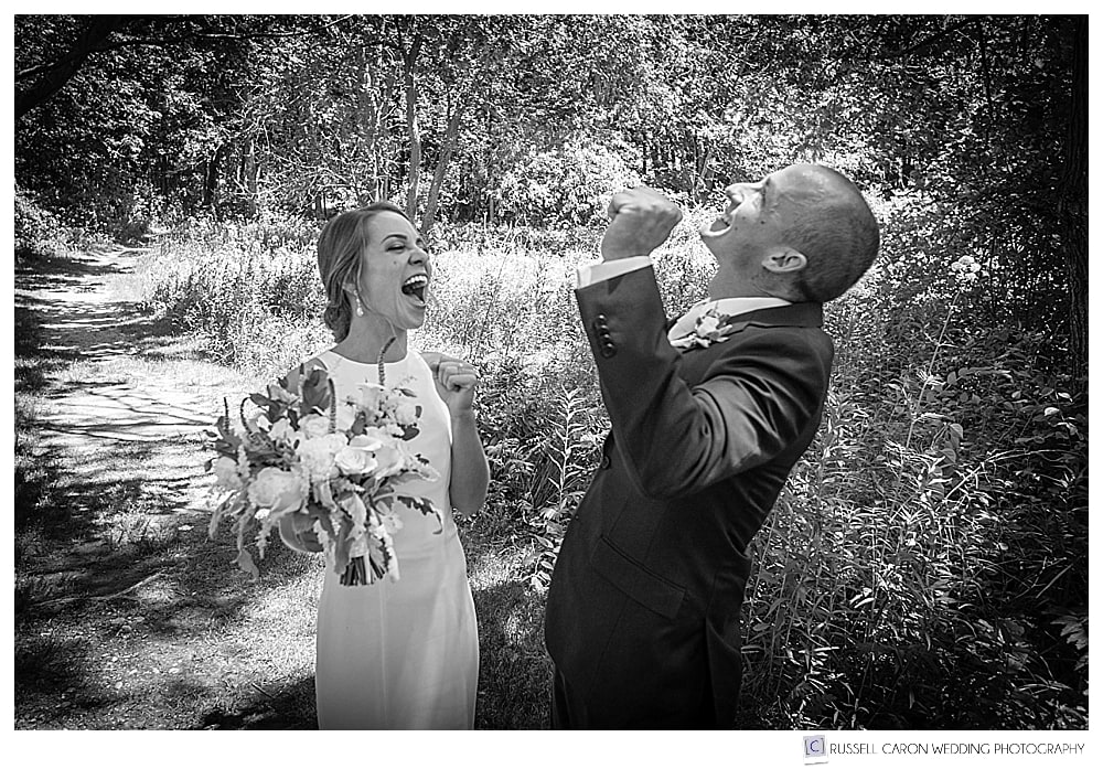 bride and groom cheer after wedding day first look