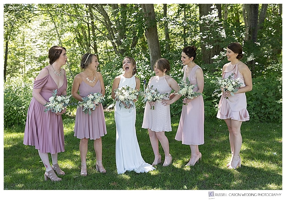 bride and bridesmaids laughing together