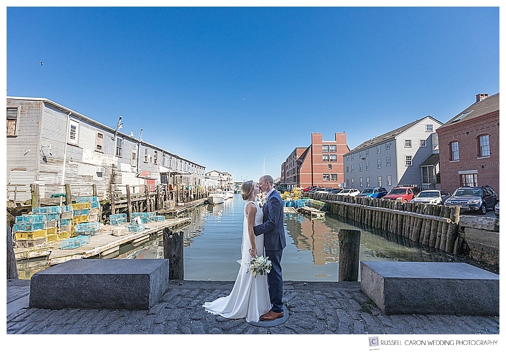 Bride and groom kissing near Portland Harbor, Portland Maine wedding photographers