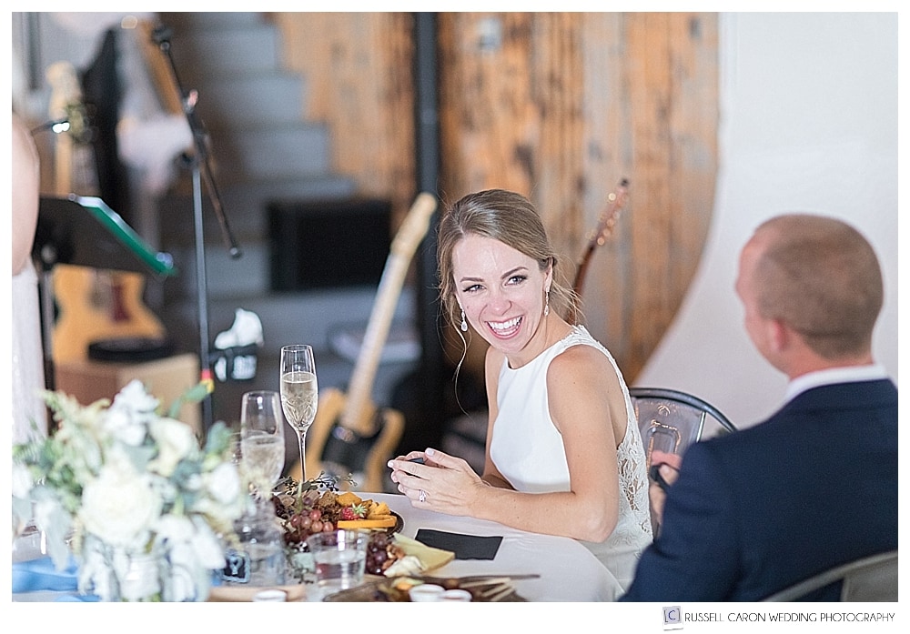 bride laughing during toast by the bridesmaids, O'maine Studios Maine wedding photographers