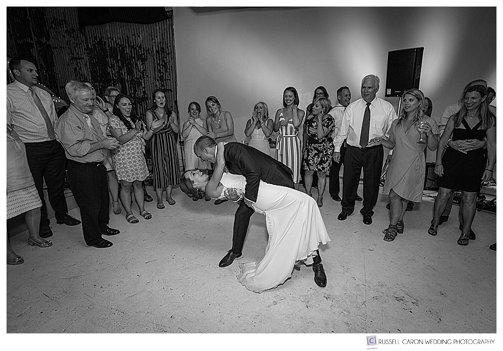 the groom dips the bride at o'maine studios wedding reception, portland maine wedding photographers