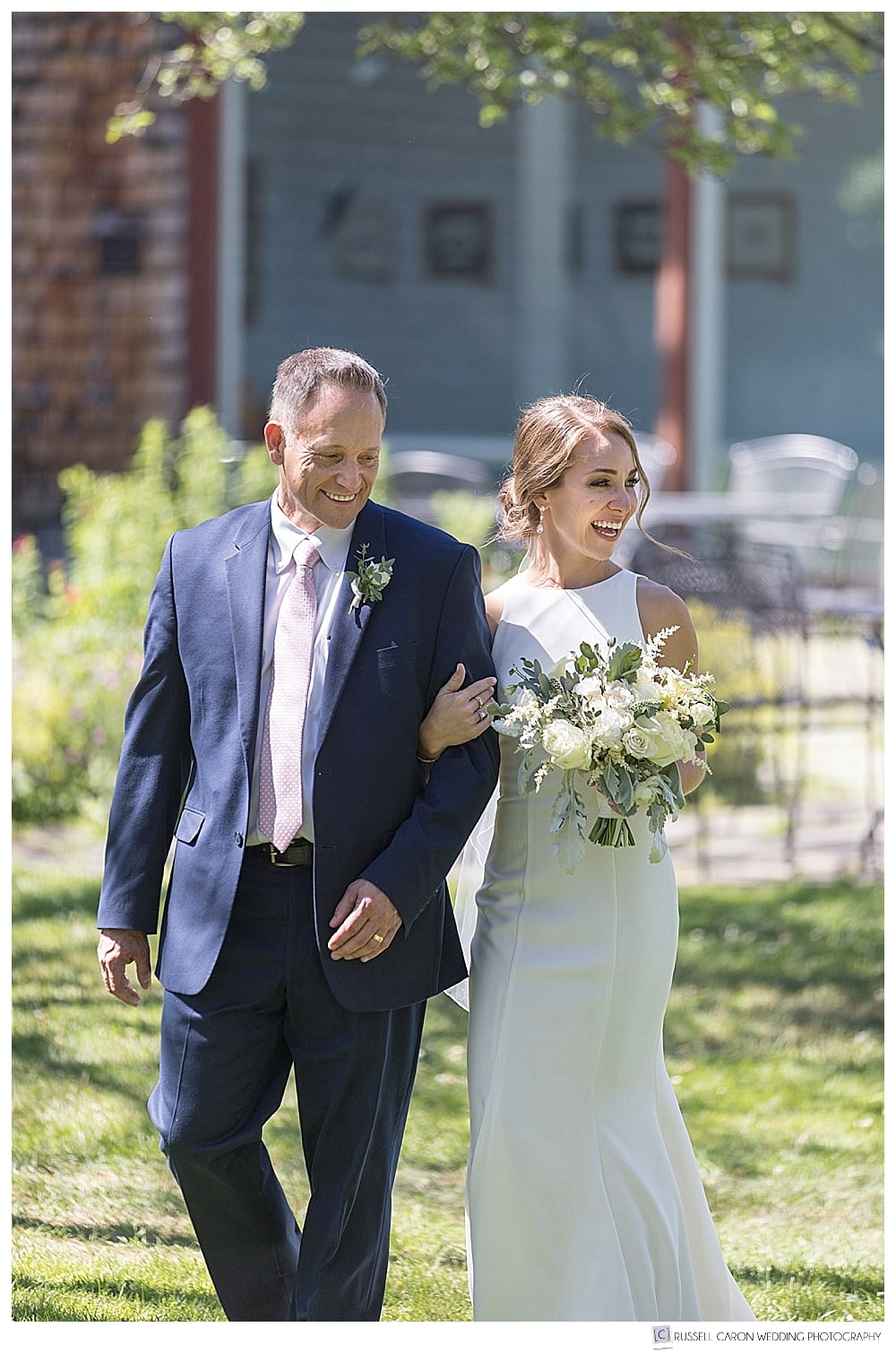bride and her father walk down the aisle during a Gilsland Farm Audubon Center outdoor wedding, Falmouth, Maine