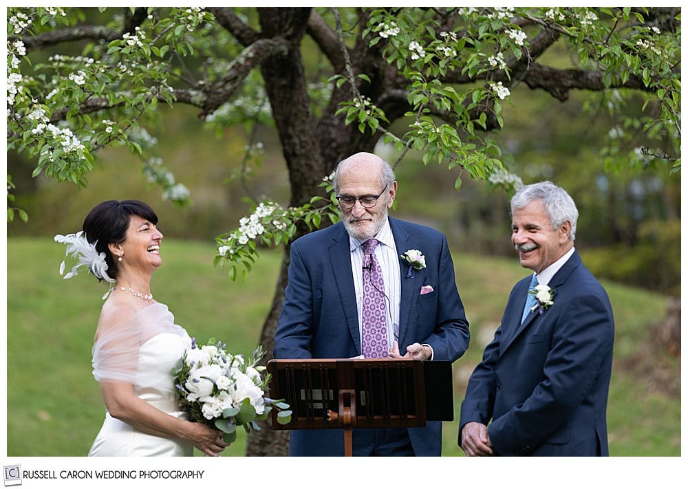 bride and groom laughing during their wedding ceremony