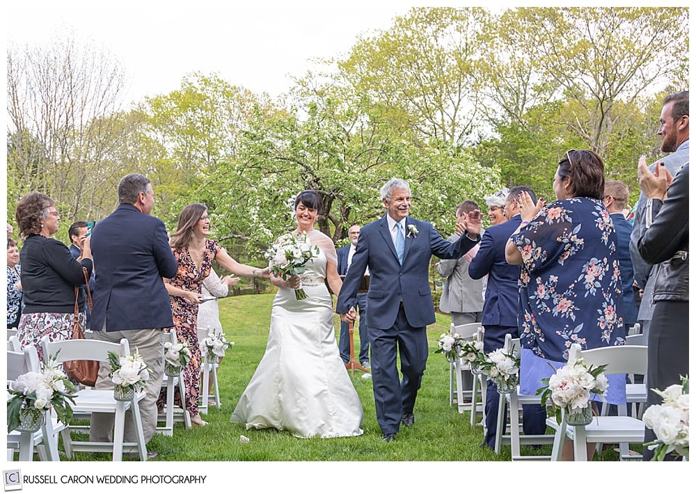 bride and groom during their recessional at their intimate cape neddick wedding ceremony