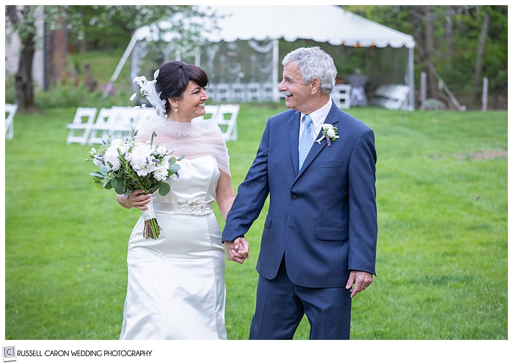 bride and groom walking and talking together