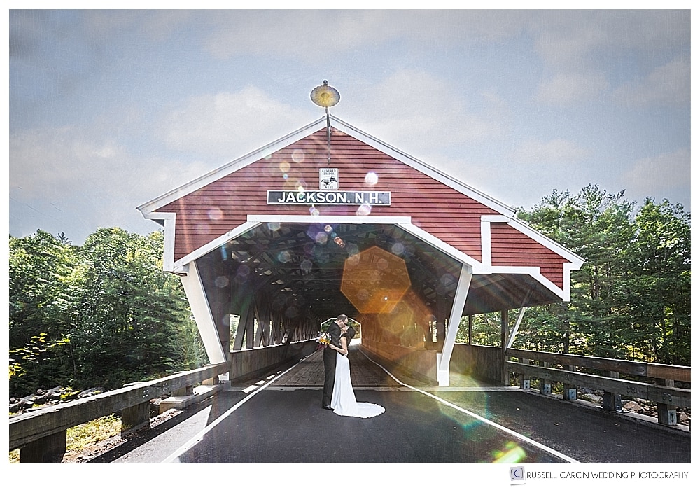 bride and groom in front of the covered bridge in Jackson, New Hampshire