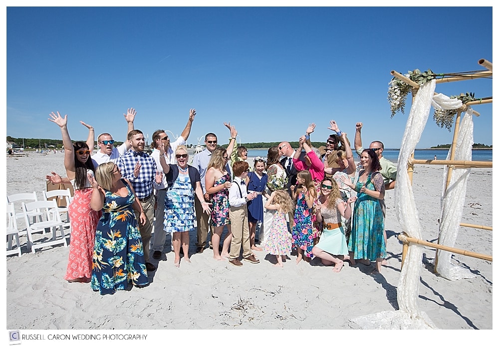 wedding-guests-with-bride-and-groom-on-goose-rocks-beach-kenebunkport
