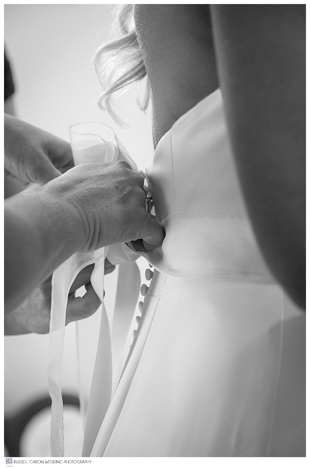 tying the bride's sash