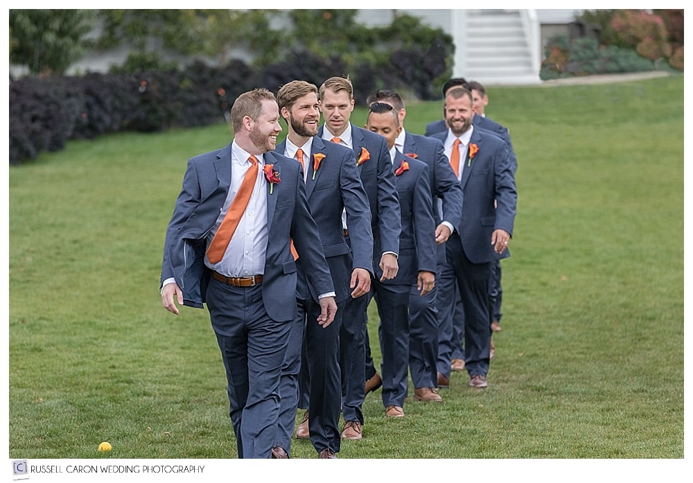 groom and groomsmen walking 