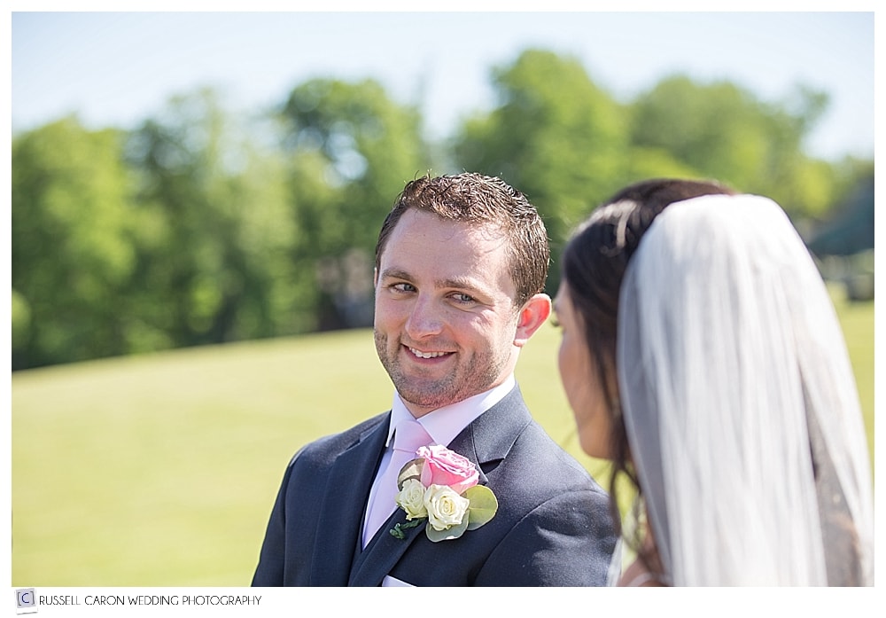 groom-looking-at-bride-during-wedding-ceremony