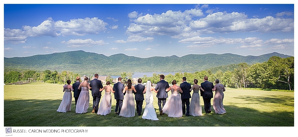 bride-and-groom-with-bridal-party-with-mountains-in-the-background