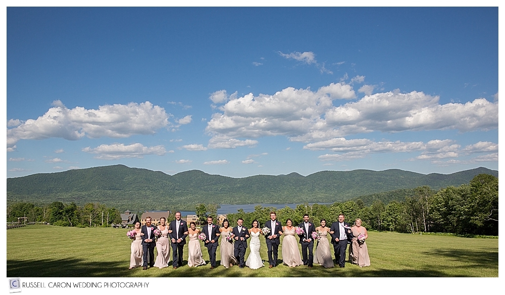 bridal-party-arm-in-arm-mountains-in-the-background