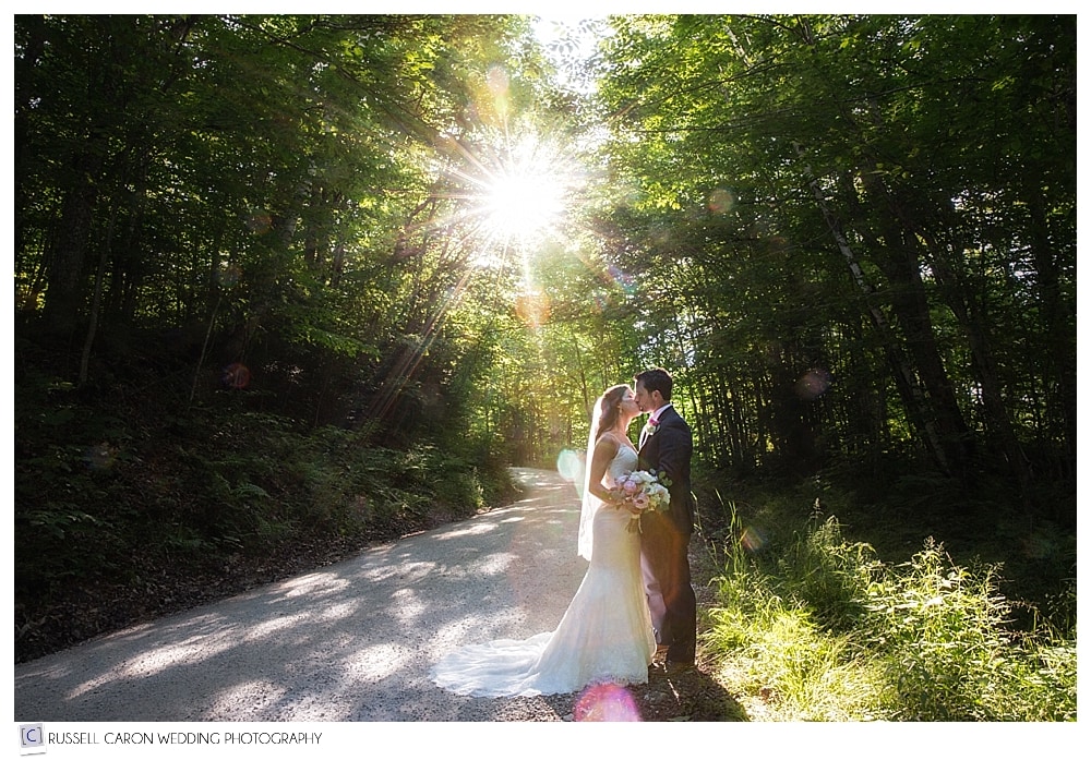 bride-and-groom-kissing-in-the-middle-of-a-dirt-road