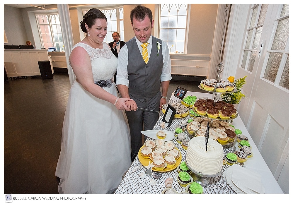 bride-and-groom-during-cupcake-cutting