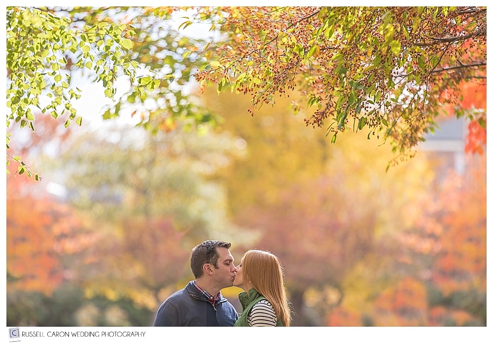 couple kissing in Maine fall foliage