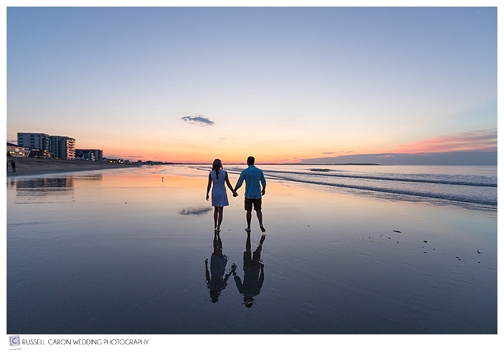 engaged couple on the beach during Maine sunrise engagement session