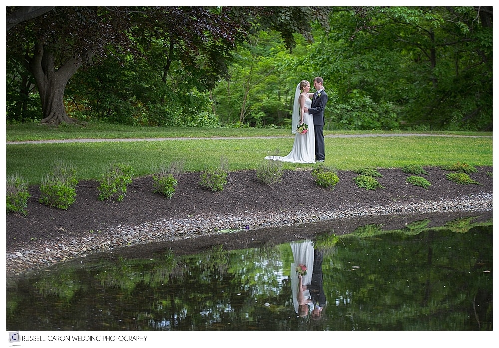 bride-and-groom-reflected-in-pond-at-mill-creek-park-south-portland-maine