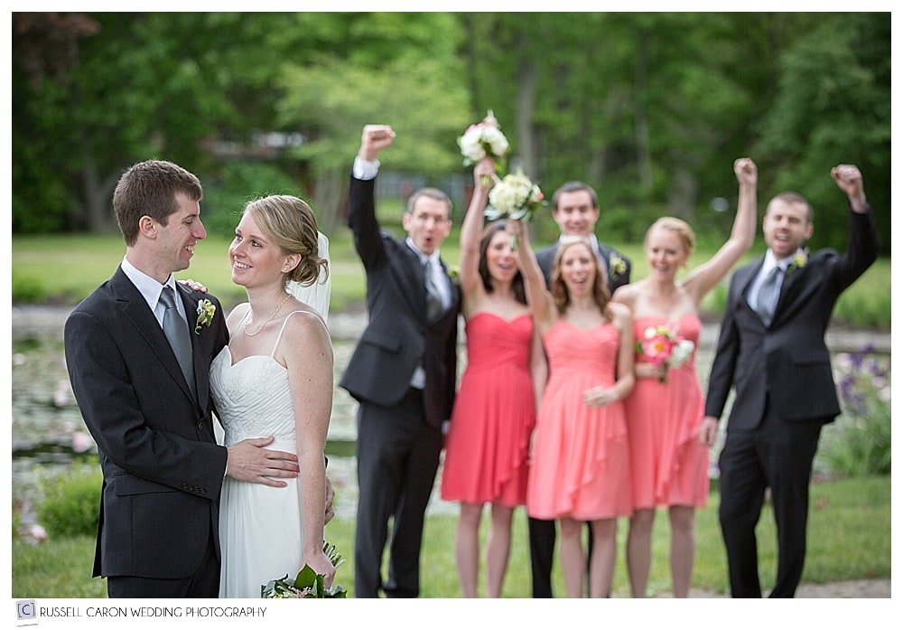bride-and-groom-with-bridal-party-cheering