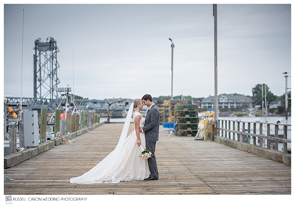 bride and groom on fishing dock