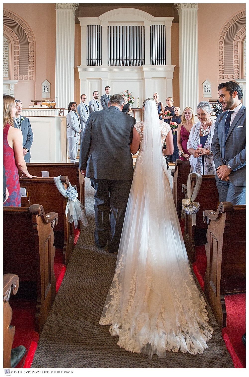 bride reaches altar with father
