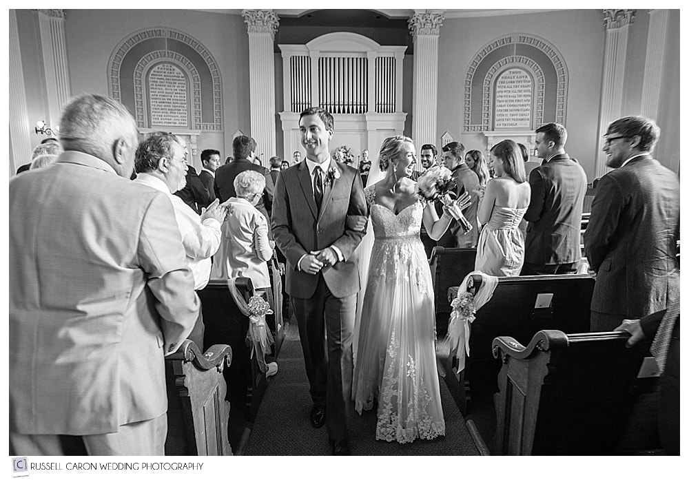 bride and groom during recessional