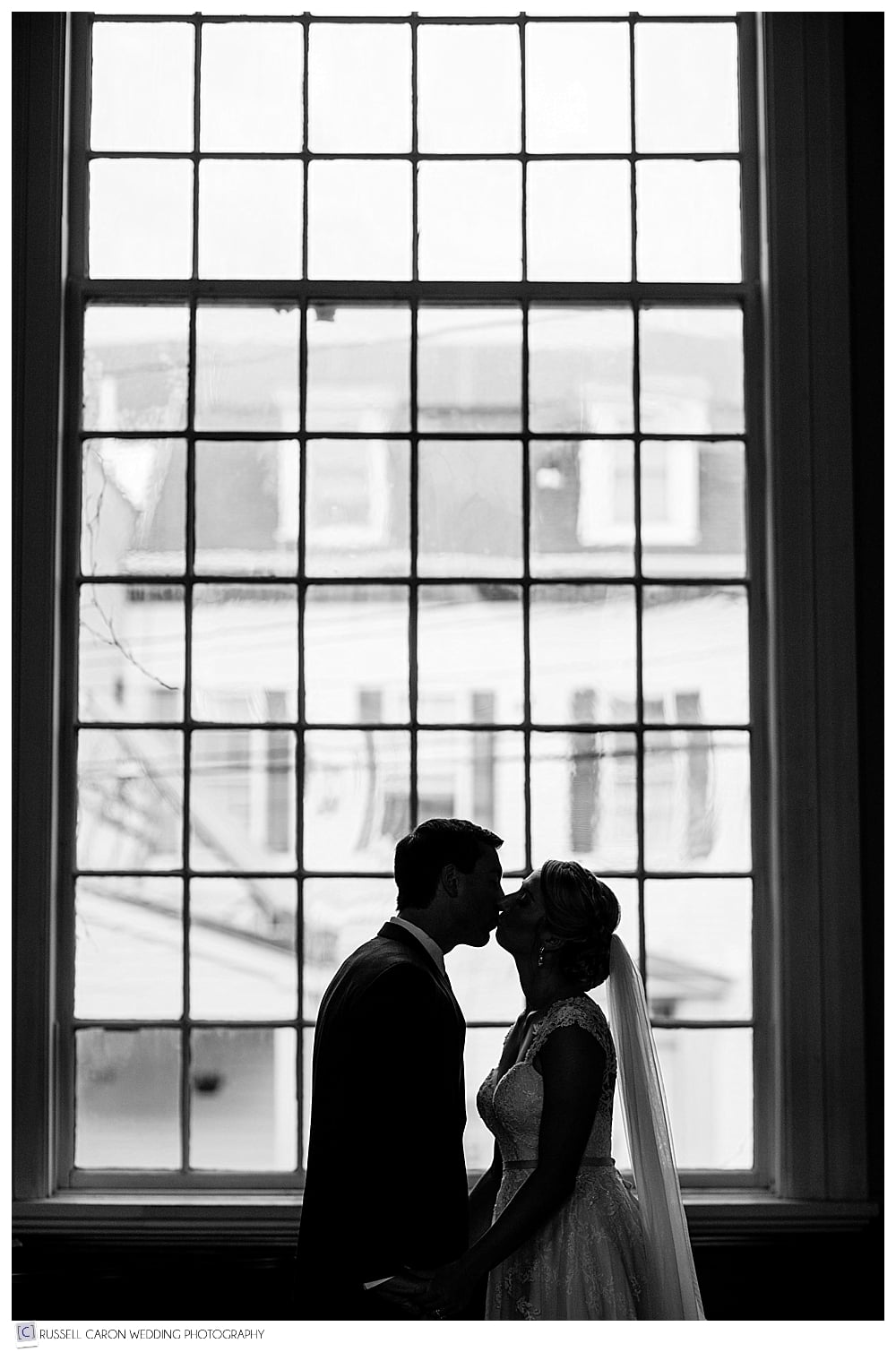bride and groom silhouette in church