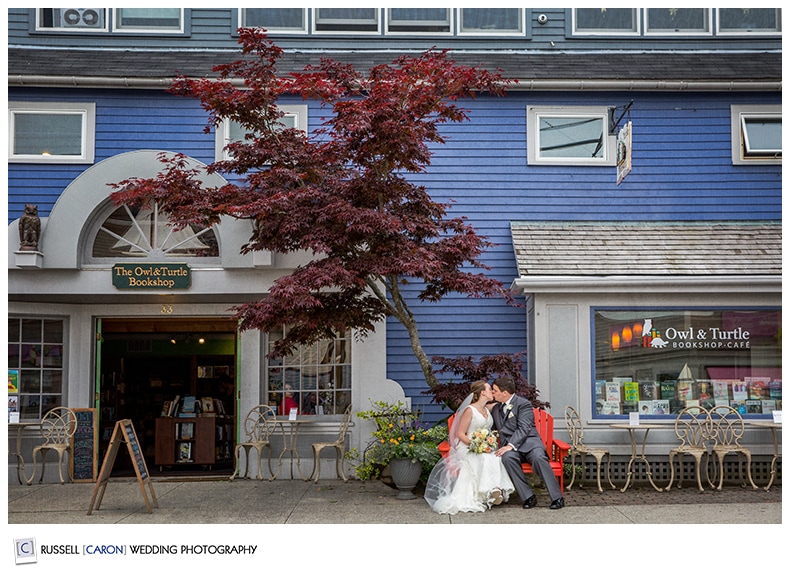 Bride and groom outside a downtown Camden Maine bookstore
