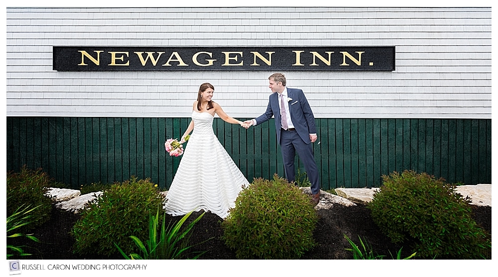 bride and groom walking past Newagen Seaside Inn barn