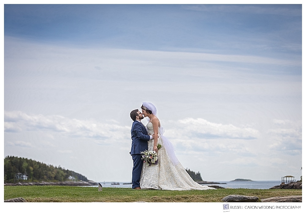 bride and groom kissing at their oceanside maine wedding at sebasco harbor resort, phippsburg, maine