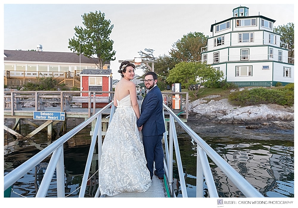 bride and groom on the dock at sebasco harbor resort