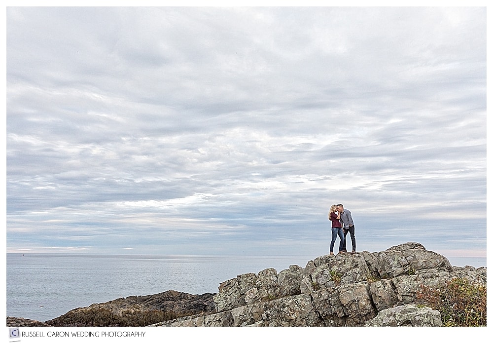 man and woman kissing on the shore during an Ogunquit Maine engagement session 