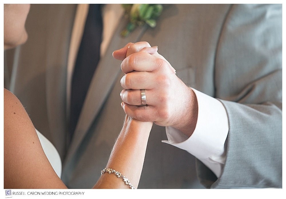 groom's hand with wedding ring