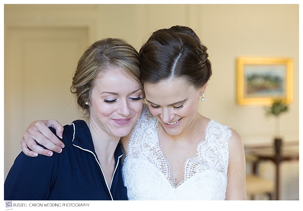 bride and maid of honor hugging