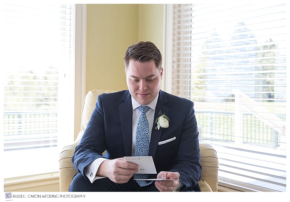 groom reading letter from bride
