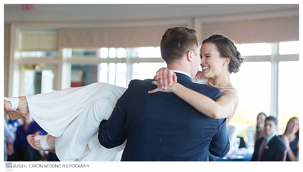 bride smiling at groom during first dance