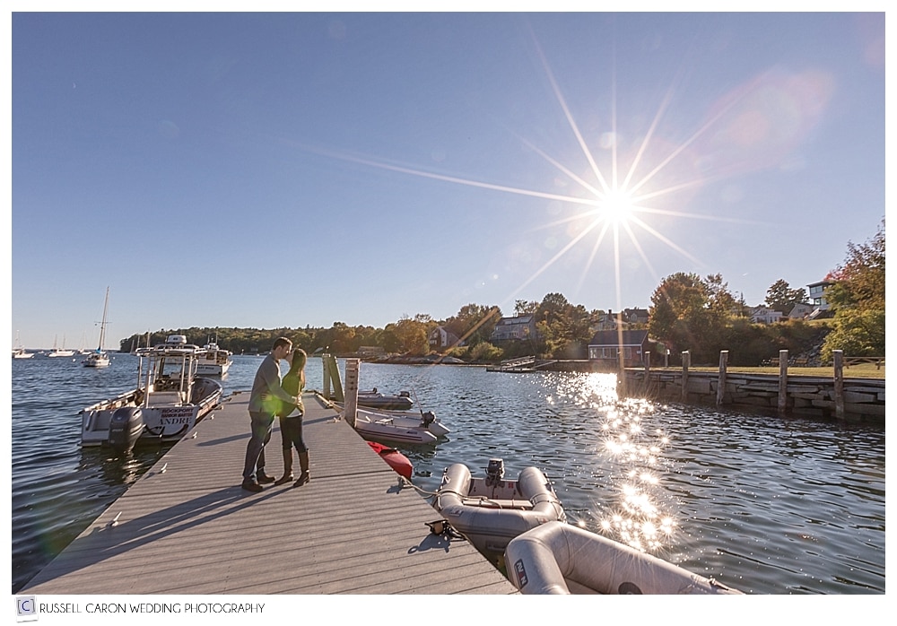 Engaged couple on the Rockport Harbor Maine dock